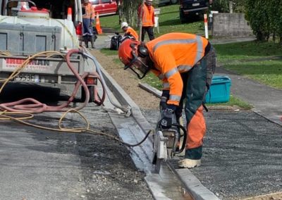 Handsawing of driveway and slurry collection - Hamilton City Council work