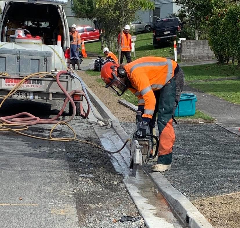 Handsawing of driveway and slurry collection - Hamilton City Council work
